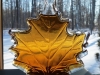 Decorative maple leaf bottle of put Wisconsin maple syrup.